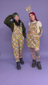 Video of Florence a red haired tattooed femme white model wearing a Waffle Mama Design print pinafore in multi colours. Flo is wearing bunny ears.