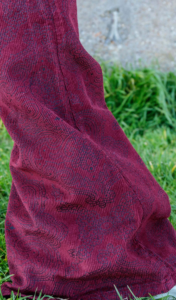 Close up shot of the tawney port paisley corduroy bell bottom super flares flared bottoms.