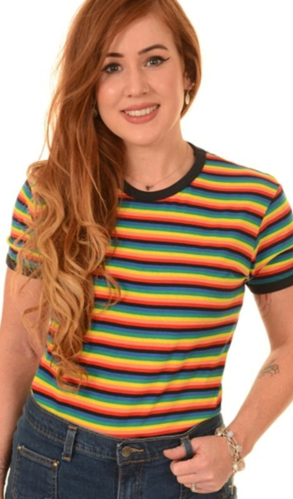 Model with long red hair, standing against a white background, wearing the Retro Rainbow Brights Repeat Striped T Shirt