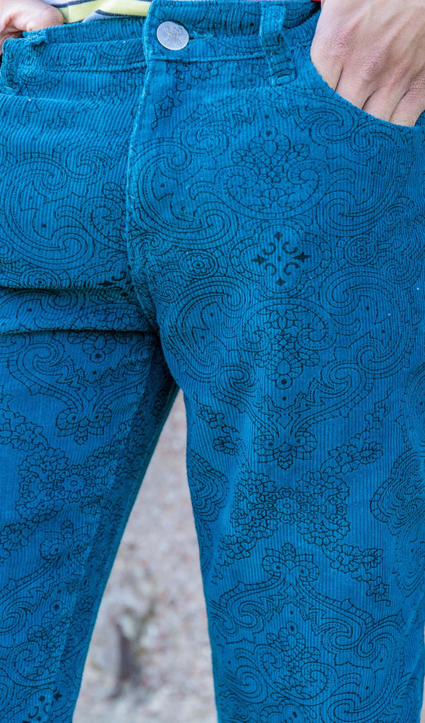 Close up photo of the zip fly close and pattern detailing on the ink blue paisley corduroy bell bottom super flares.