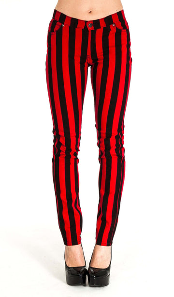 Model is facing towards the camera wearing red and black vertically striped skinny jeans with black heels. Photo is cropped from the waist down.
