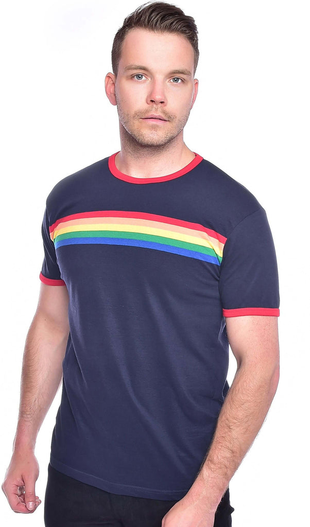 Model is stood in front of a white studio background wearing the navy ringer retro rainbow striped tshirt with black denim jeans. They are facing the camera with both hands resting by their side. Photo is cropped from the hips up.