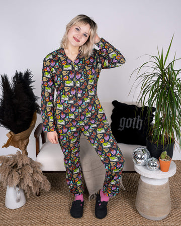 The Halloween: Bewitched Stretch Twill Boiler Suit by Run & Fly, modelled with confidence. This ethical jumpsuit, adorned with enchanting patterns, showcases vibrant Halloween-inspired designs. The model poses front-facing, highlighting the sustainable, stylish all-in-one fashion piece.
