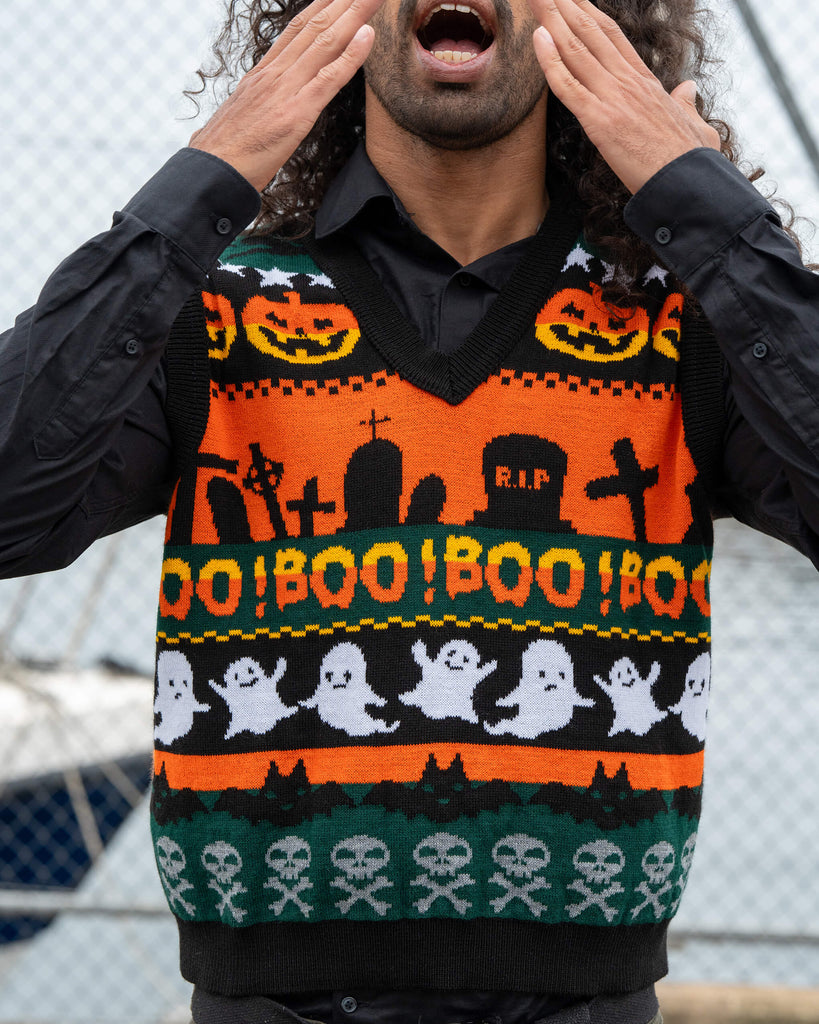 Close-up of the Run & Fly BOO! Tank Vest featuring pumpkins, ghosts, skulls, and “BOO!” text in orange, green, and black Halloween knit design.