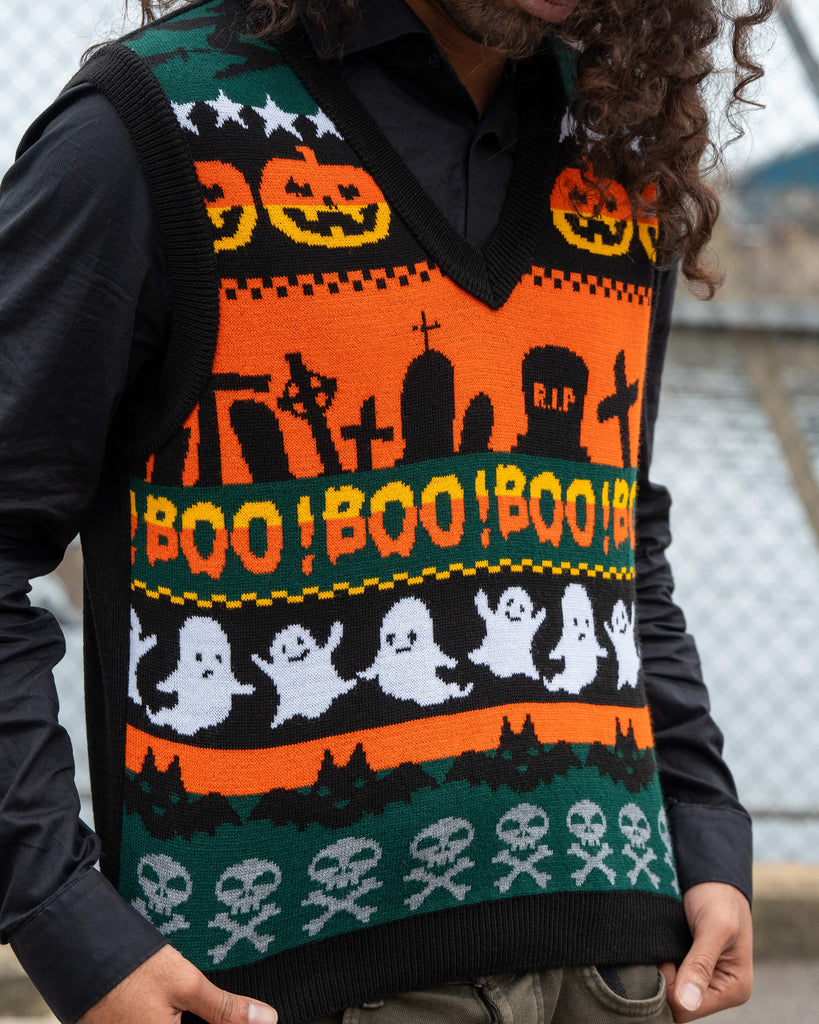Model Rich wears the Run & Fly BOO! Tank Vest with a spooky Halloween knit featuring ghosts, pumpkins, and gravestones. Unisex and made in England.