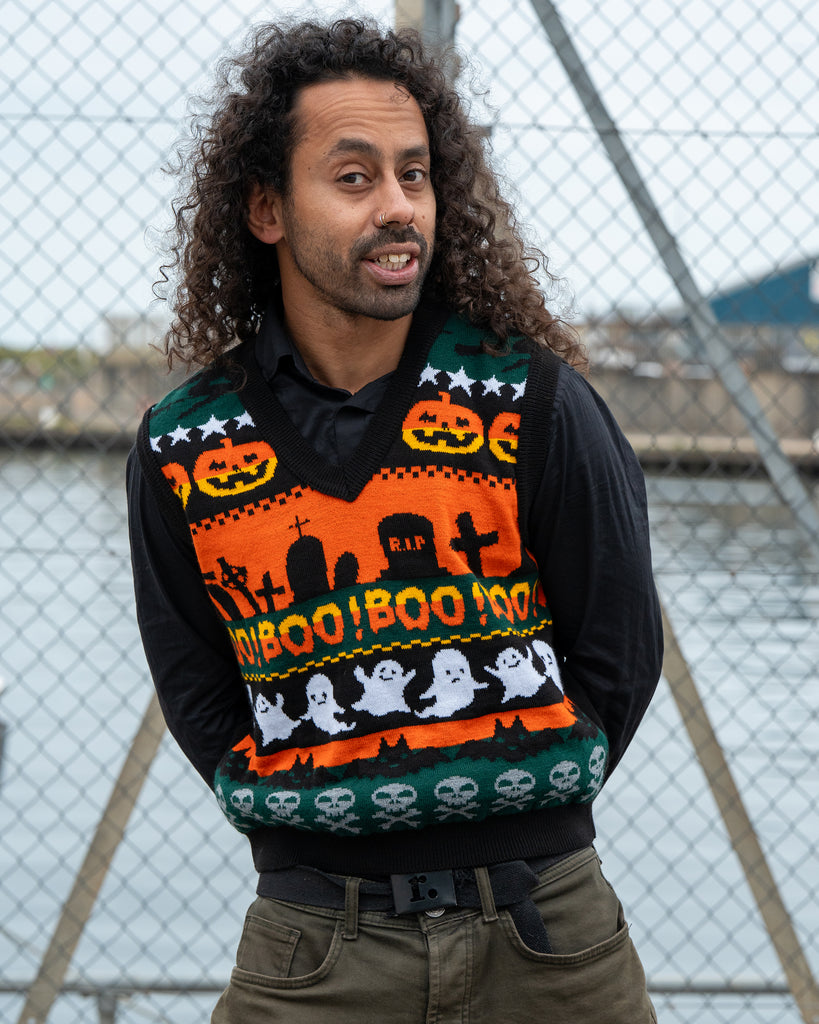 Close-up of the Run & Fly BOO! Tank Vest showing the knitted design with ghosts, pumpkins, gravestones, and skulls in bright Halloween colours.