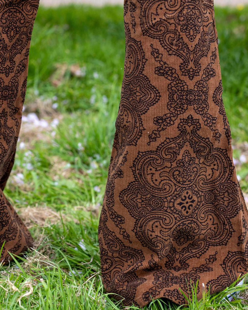Close up of Jack wearing Hendrix Tan Paisley Corduroy Retro Bell Bottom Flares. Close up shows the flared bellbottoms.