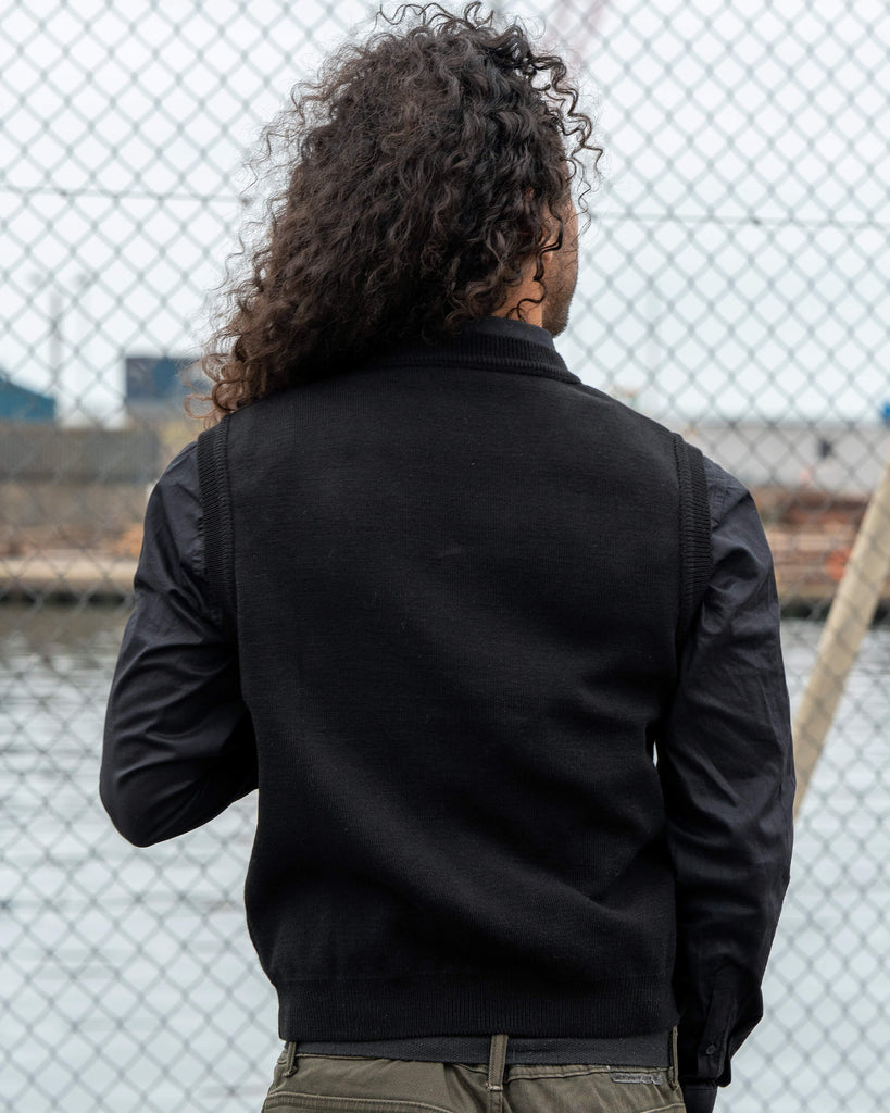 Back view of the Run & Fly Red Dino Tank Vest showing the plain black knit design. Unisex and made in England.