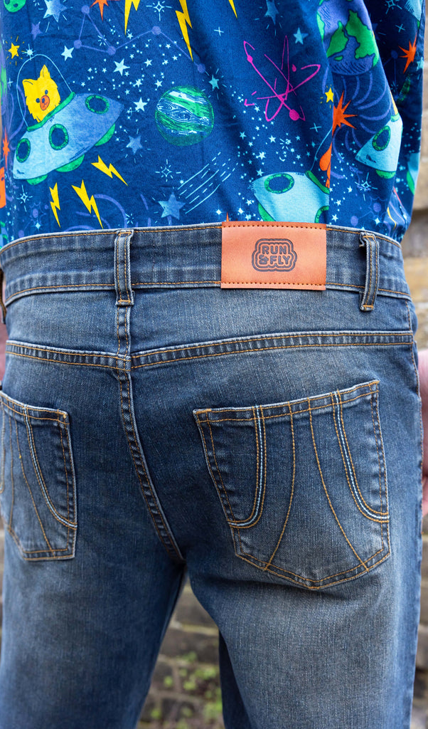 close up of the back of Unisex Distressed Denim Bellbottom Flares Mid Rise Jeans showing Run & Fly label and back pocket