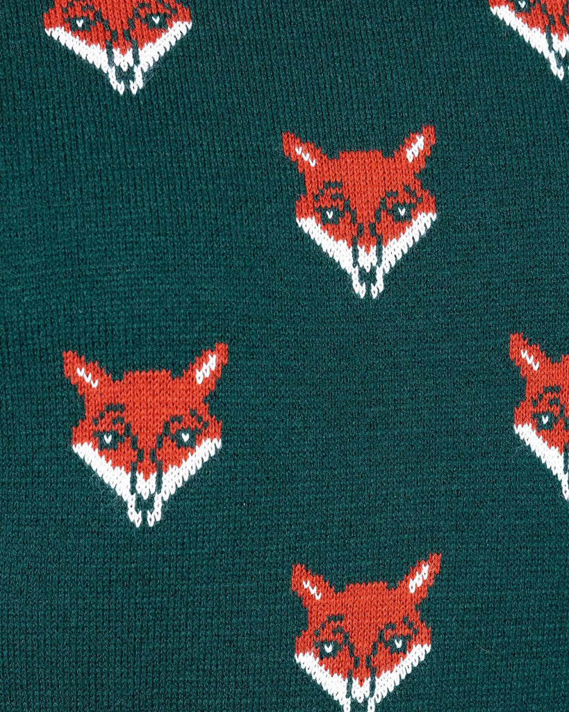 close up of Forest Green Fox Head Jumper. The green long sleeved jumper has an all over print of fox heads.