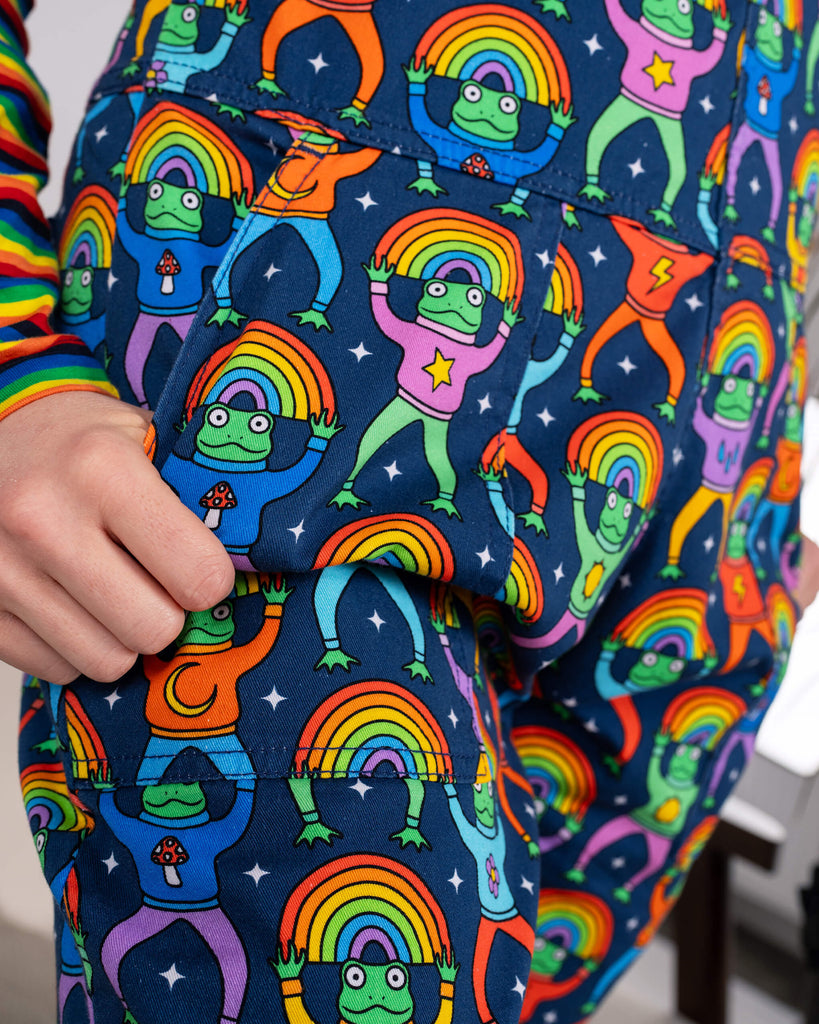 Close-up of the side pocket of Run & Fly Rainbow Frogs Stretch Twill Dungarees, featuring adorable cartoon frogs holding rainbows, adding a quirky touch to ethical slow fashion.