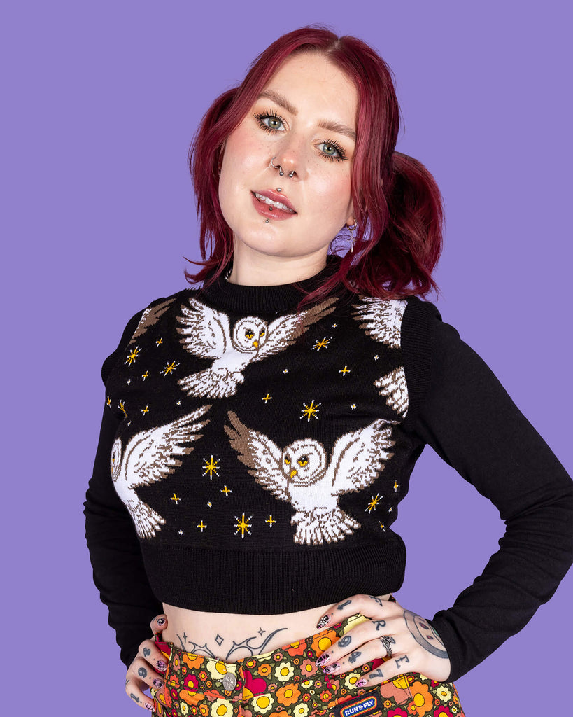  Close up of model wearing Owl Cropped tank. It has cute barn owls flying with yellow stars on a black background
