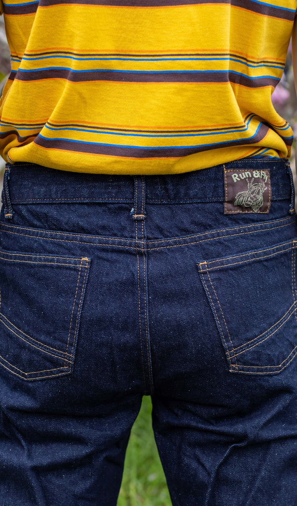 Close up shot of the back label on the denim retro boot cut flare jeans.