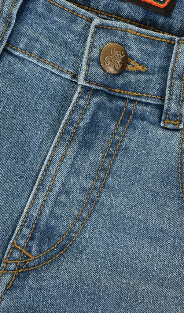 Close up shot of the bee button close on the distress denim skinny fit jeans.