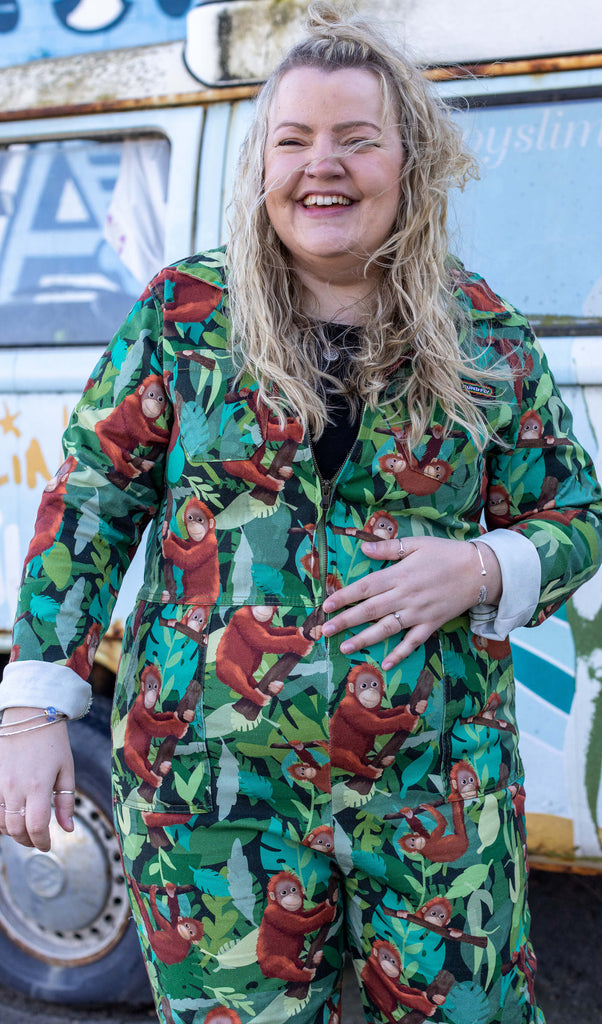 image of Jen James laughing wearing a boiler suit with orangutang's on 