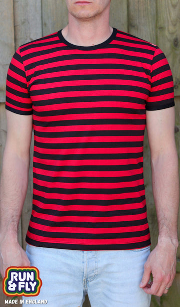 Model is wearing the Black & Red Stripe Short Sleeve T Shirt with light coloured denim jeans