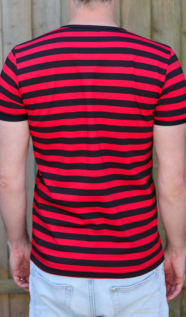 Back view of a model is wearing the Black & Red Stripe Short Sleeve T Shirt with light coloured denim jeans
