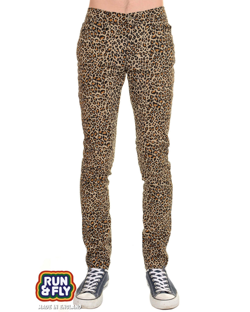 a male model wearing tight natural coloured leopard print fitted trousers