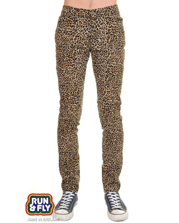 a male model wearing tight natural coloured leopard print fitted trousers