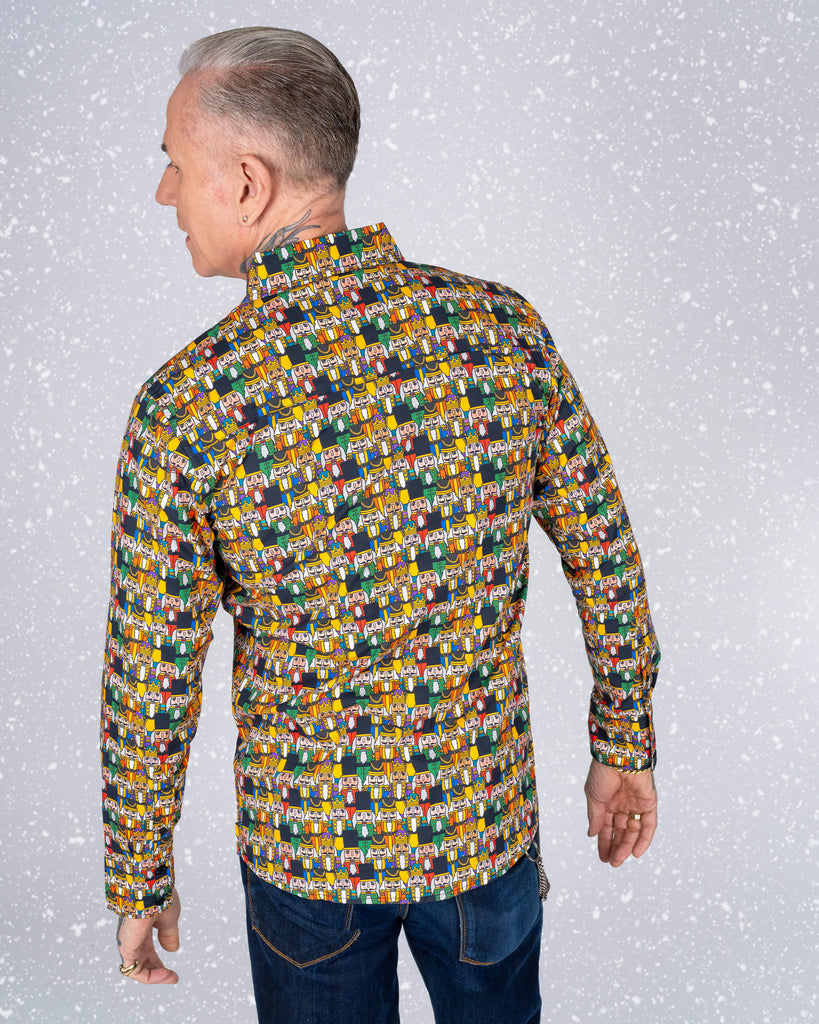Back view of the Nutcracker print shirt, with James showcasing the seamless pattern of colourful Nutcracker characters on a dark background.