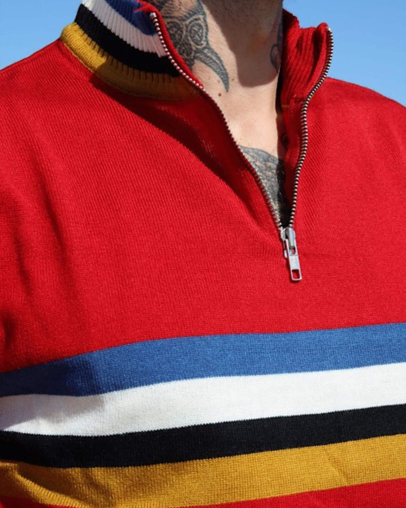 Close up of the neck of the Red Retro Zip Neck Jumper, the zip is undone to the chest and model has tattoos on their through and chest