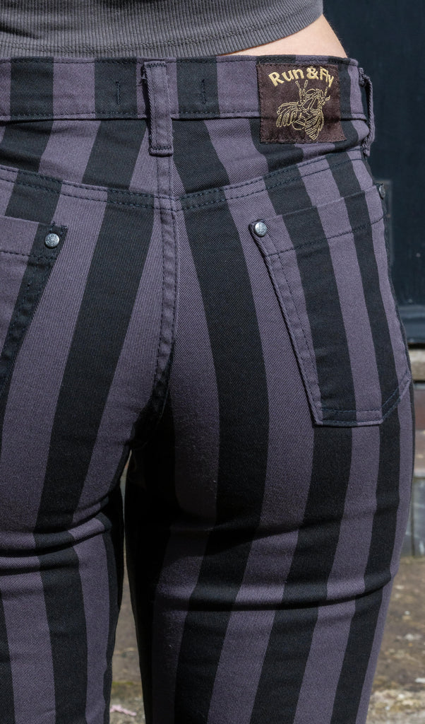 back pocket of black and grey striped jeans