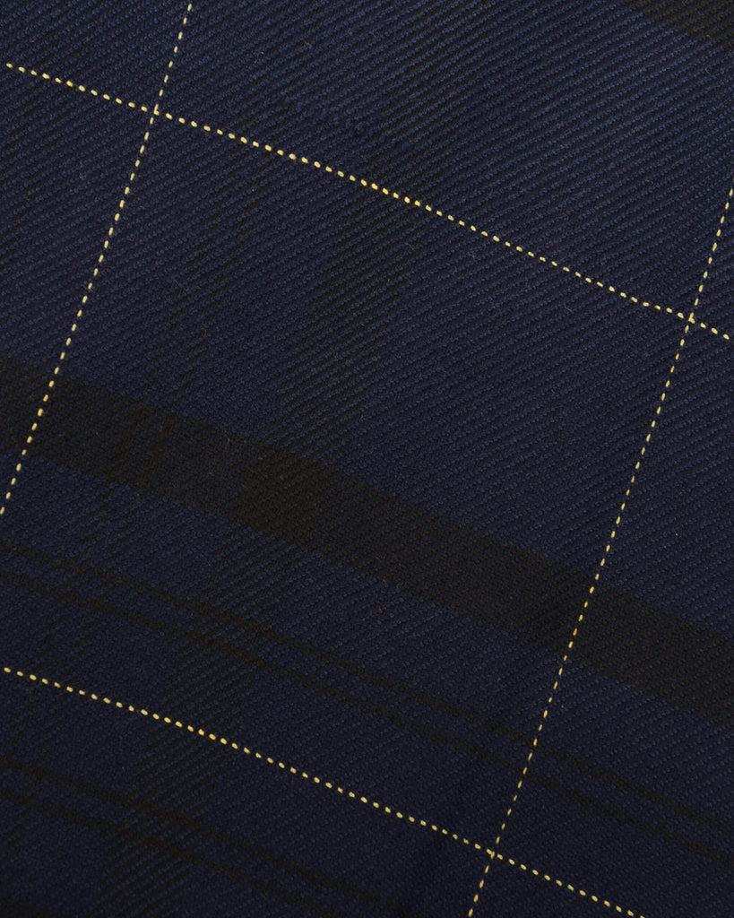 Close up shot of the retro mod stretch navy plaid tartan slim skinny fitting trousers fabric.