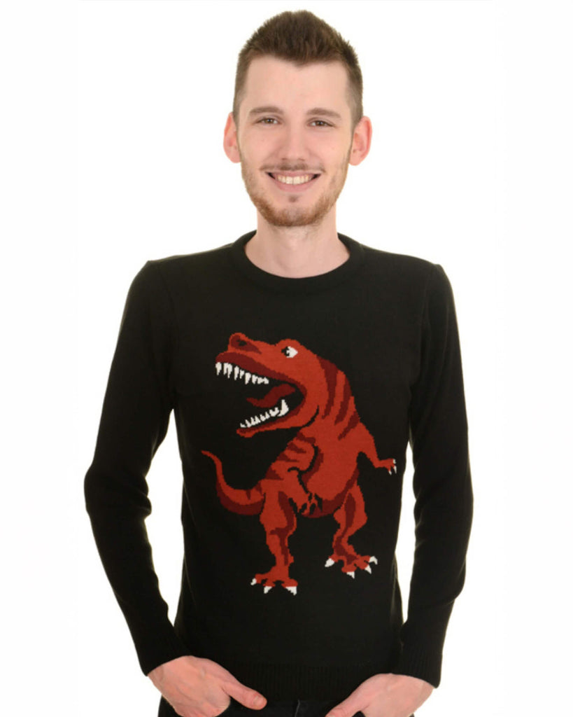 Model is smiling at the camera against a white backdrop. They are wearing the T Rex Dino-Roar Jumper with black trousers