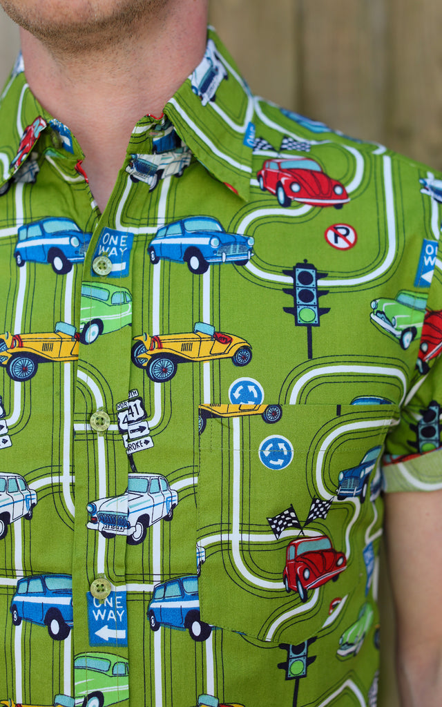 Close up shot of the kiwi car highway short sleeve shirt collar and button detailing. 