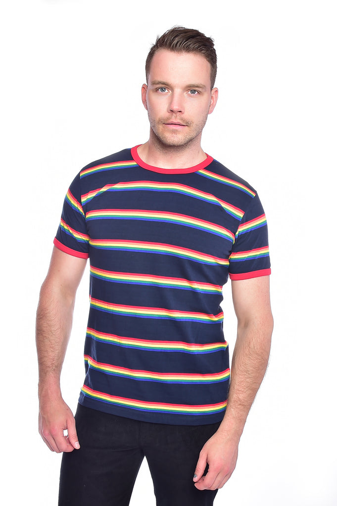 Model in front of a white background wearing the retro rainbow block striped tee